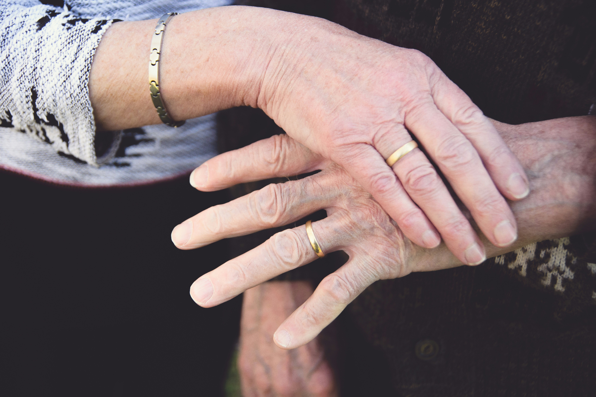 Elderly hands clasped